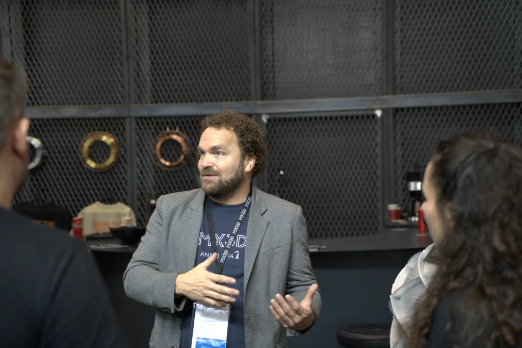 Gijs van der Velden, MX3D CEO at the FormNext booth of MX3D, talking with customers and investors.